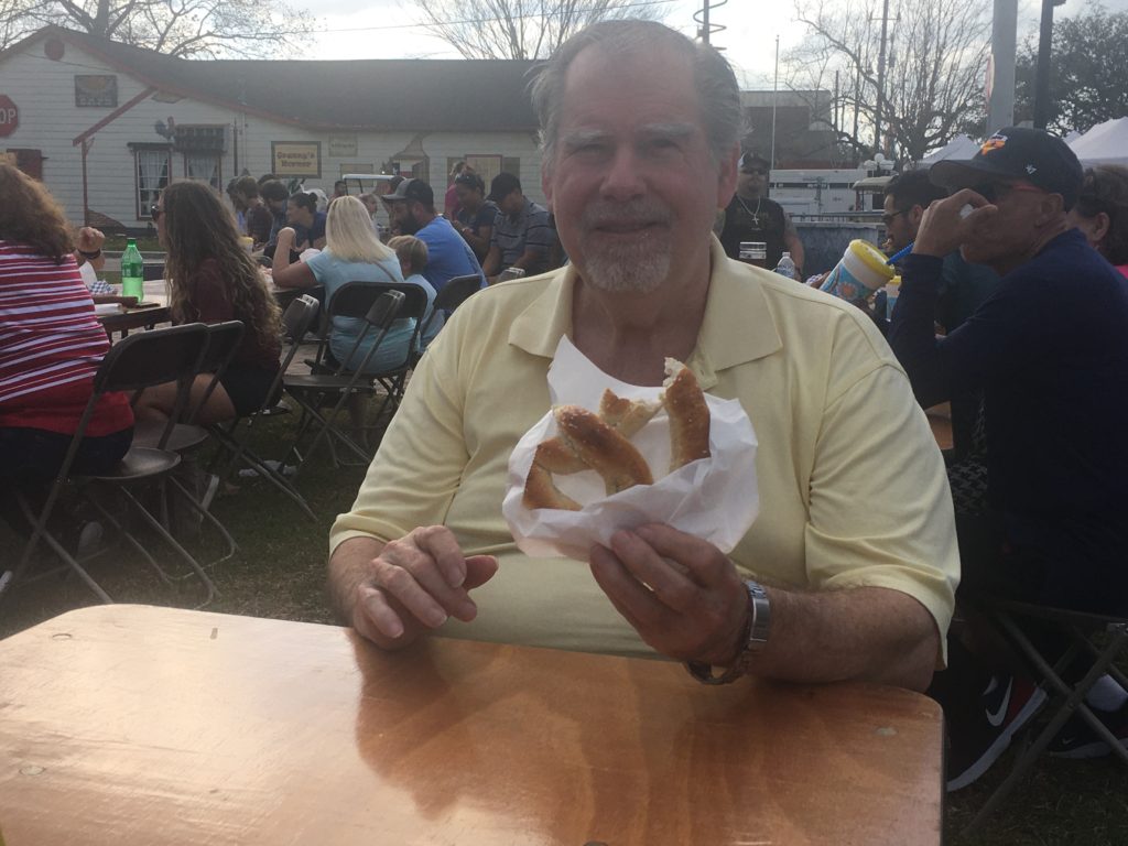 Bill enjoying authentic German pretzel at Tomball German Christmas Festival 2019