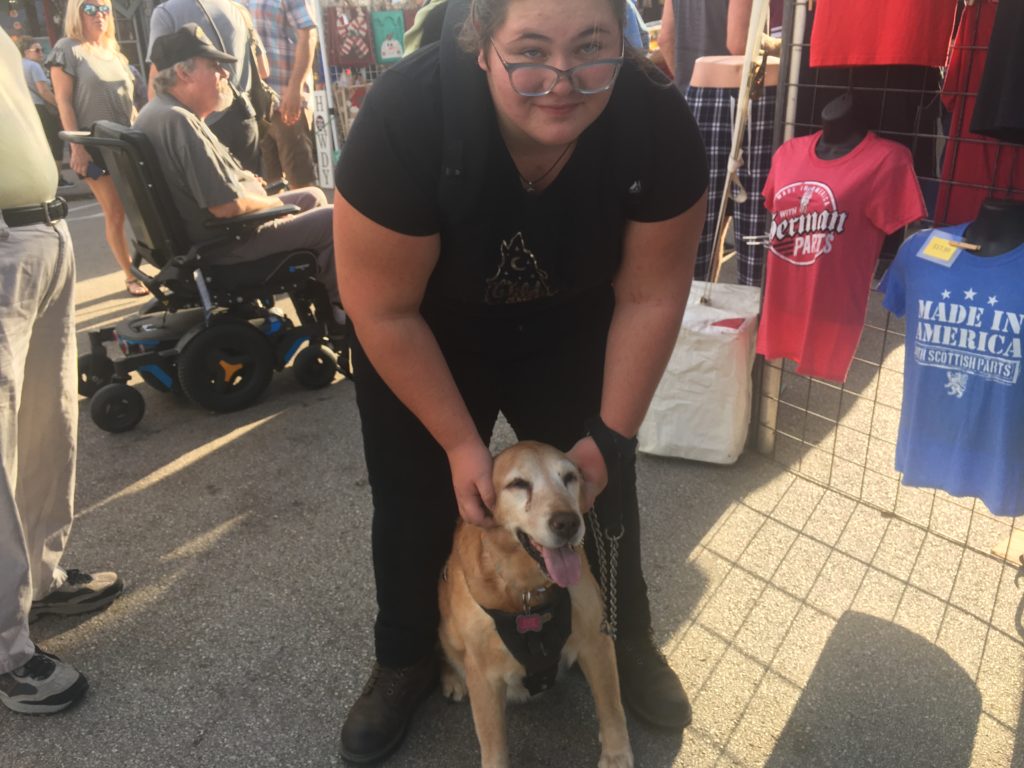 Carol's granddaughter with their dog Caramel at Tomball German Fest